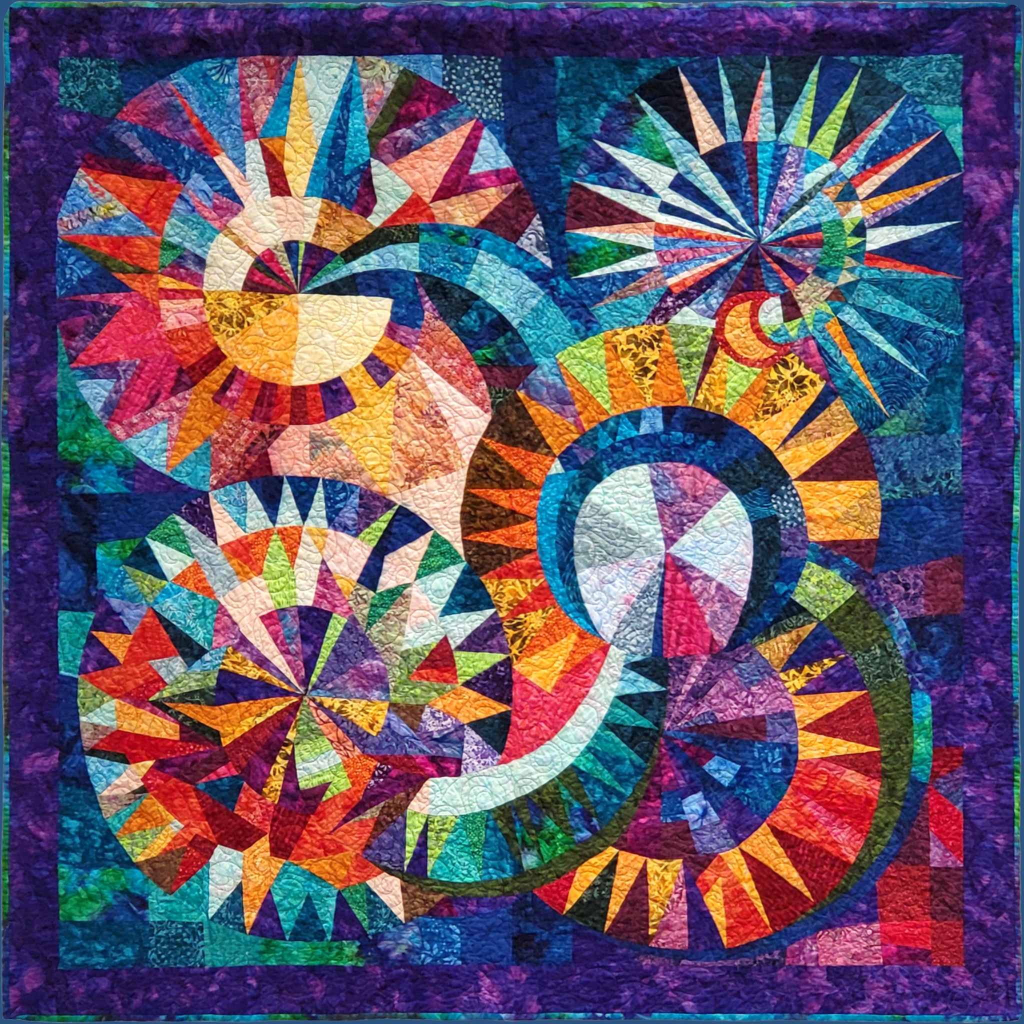 AI Dream of a Techno Quilt, a brightly colored quilt with circular and spiral forms in saturated blues, purples, reds, oranges, and greens.